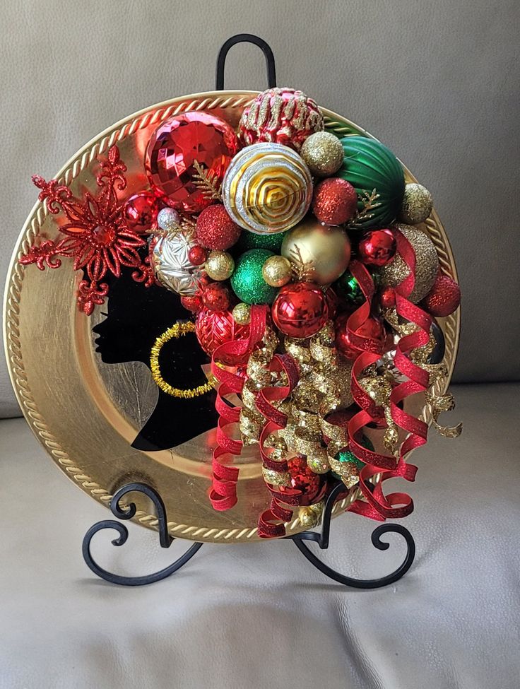 a gold plate with red and green ornaments on it