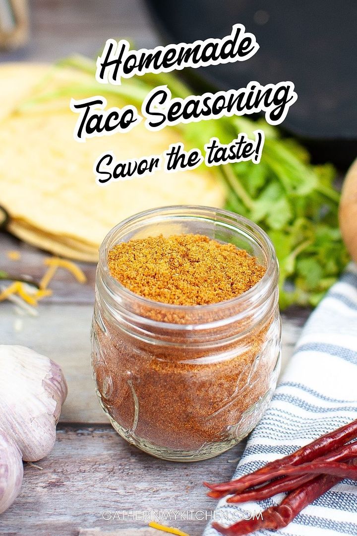 homemade taco seasoning in a jar next to vegetables