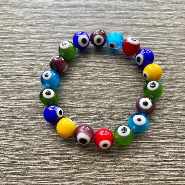 Lampwork Handblown Glass Evil Eye Bracelet. Multicolored. Handmade In The Usa And Never Worn. One Size Fits All. Multicolor Evil Eye Bracelet Gift, Casual Multicolor Beaded Evil Eye Bracelet, Multicolor Evil Eye Round Bracelets, Multicolor Round Evil Eye Bracelets, Vibrant Multicolor Bracelets As A Gift, Vibrant Red Bracelets For Gift, Vibrant Multicolor Bracelets As Gift, Vibrant Multicolor Bracelets For Gift, Multicolor Evil Eye Bracelets