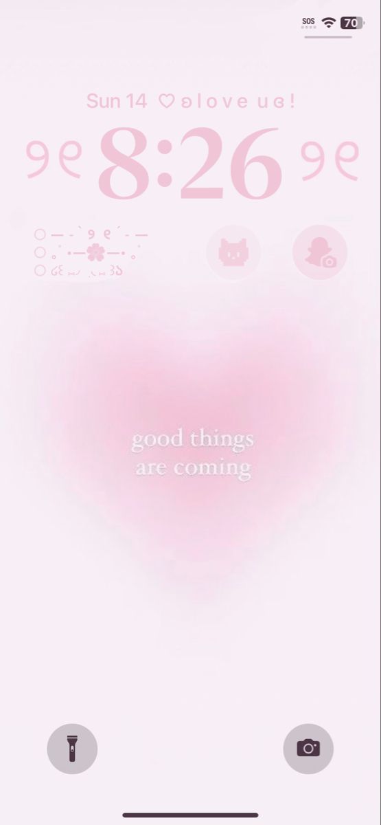 an iphone screen with the message good things are coming in pink and white on it