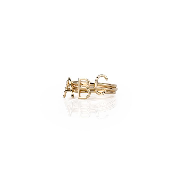 Whether you choose an initial just for her or multiple initials to represent family and children, these delicate rings can be worn alone or stacked together. Made from 14kt yellow gold, each ring is handcrafted in NYC by renowned jewelry designer, Sarah Chloe.    Available in ring size 6 or 7  Initial: 0.3" h  14kt yellow gold and optional  See Product Information for more details.  Imported  Monogramming is foil debossed. Layered Initial Necklace, Chloe Jewelry, 14kt Gold Jewelry, Heart Rings, Mom Ring, Baguette Diamond Rings, Necklace Layered, Family Necklace, Personalized Ring