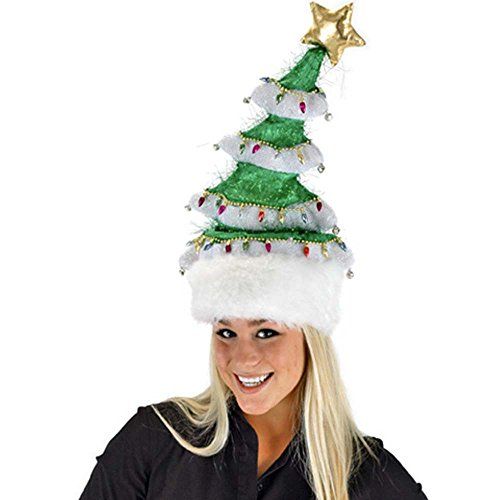 a woman wearing a green and white christmas tree hat with gold stars on the top