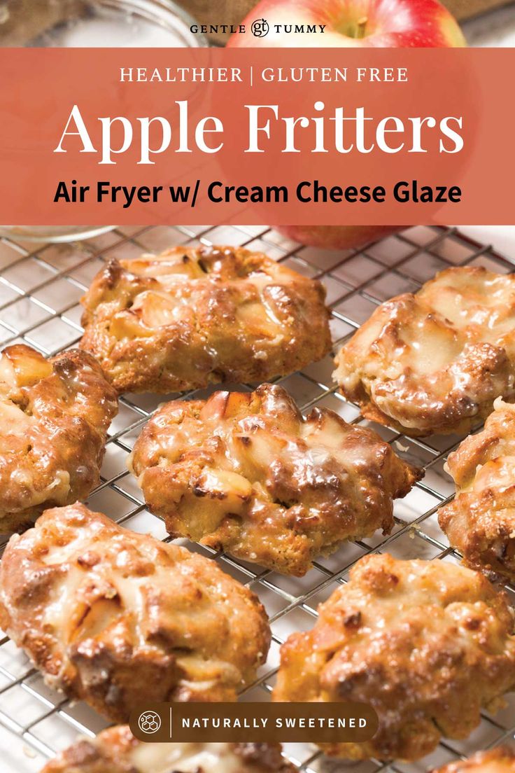 apple fritters on a cooling rack with apples in the background and text overlay that reads, healthier gluten free apple fritters air fryer w / cream cheese glaze