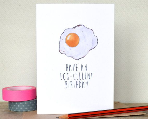 an egg - cellent birthday card sits on a table next to some pencils