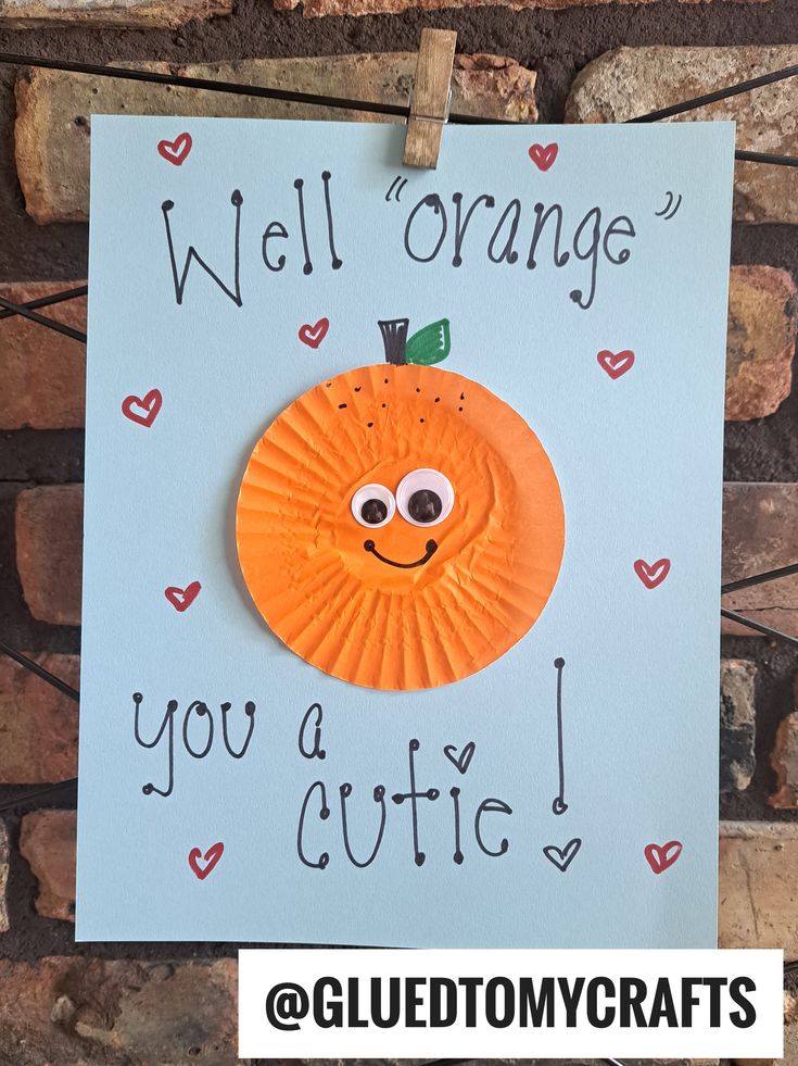 a paper plate with an orange on it and the words, well orange you a cutie