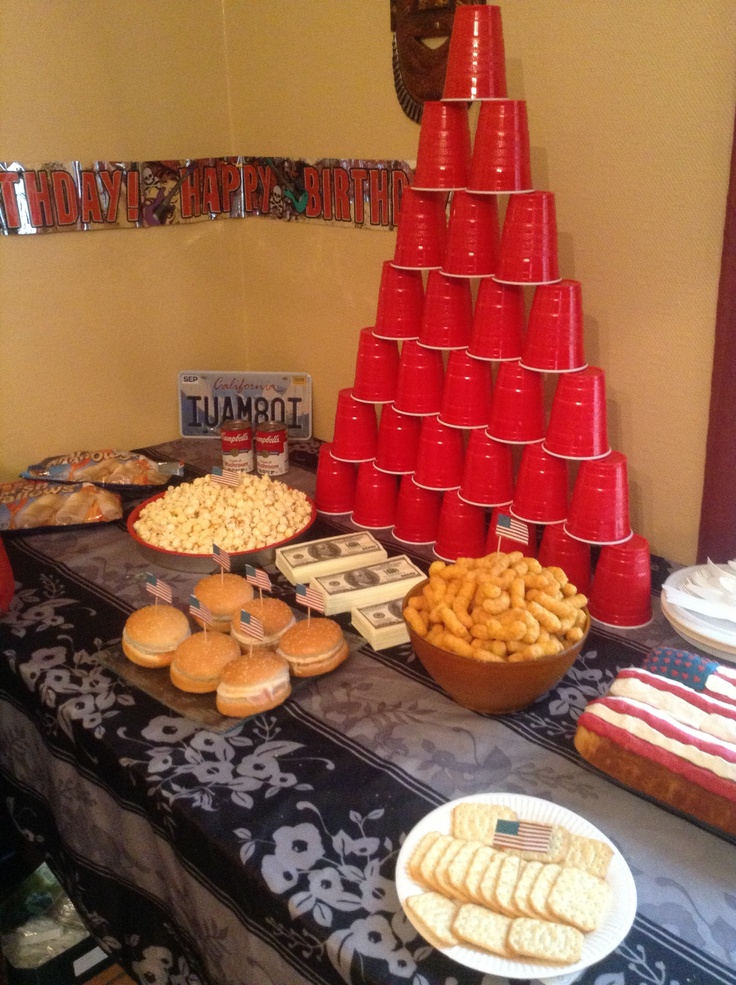 a table topped with lots of food and cups