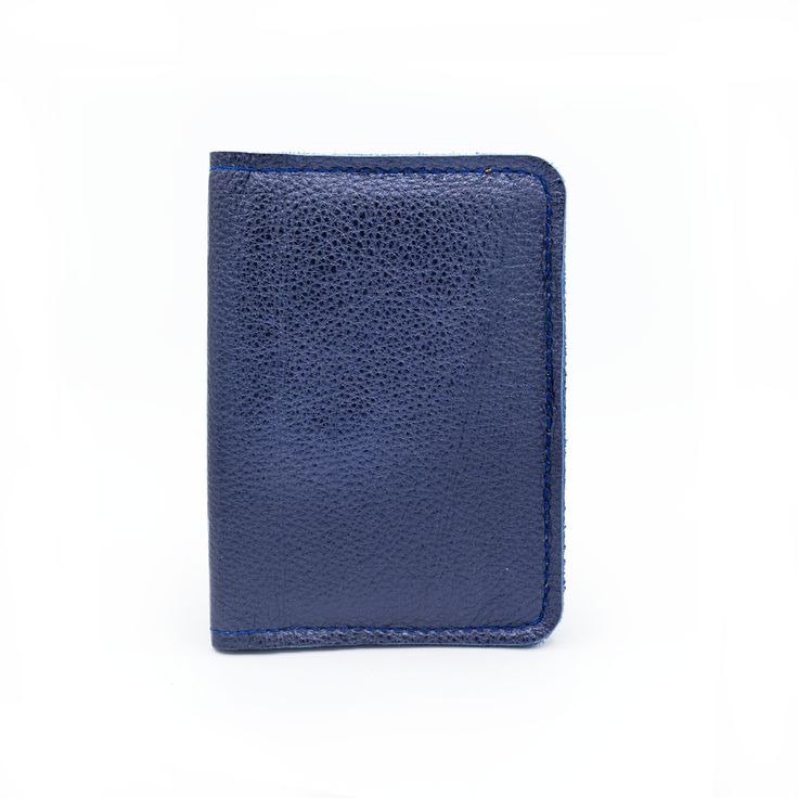 Midnight Metallic Leather Calling all world travelers! This passport holder is fashioned from soft leather and designed with two card slots for easy access to your travel essentials while keeping your passport safe and secure. Make it shine with custom gold foil monogramming. High quality leather Two inner slip pockets Dimensions 5.5"L, 5.25"W Travel Trifold Card Holder With Interior Slots, Trifold Card Holder With Interior Slots For Travel, Trifold Travel Card Holder With Interior Slots, Gold Leather Card Holder With Interior Slots, Leather Card Holder With Card Slots For Travel, Travel Textured Leather Bifold Wallet, Luxury Trifold Wallet With Card Slots For Travel, Luxury Rfid Blocking Trifold Wallet For Travel, Leather Travel Wallets With Id Window