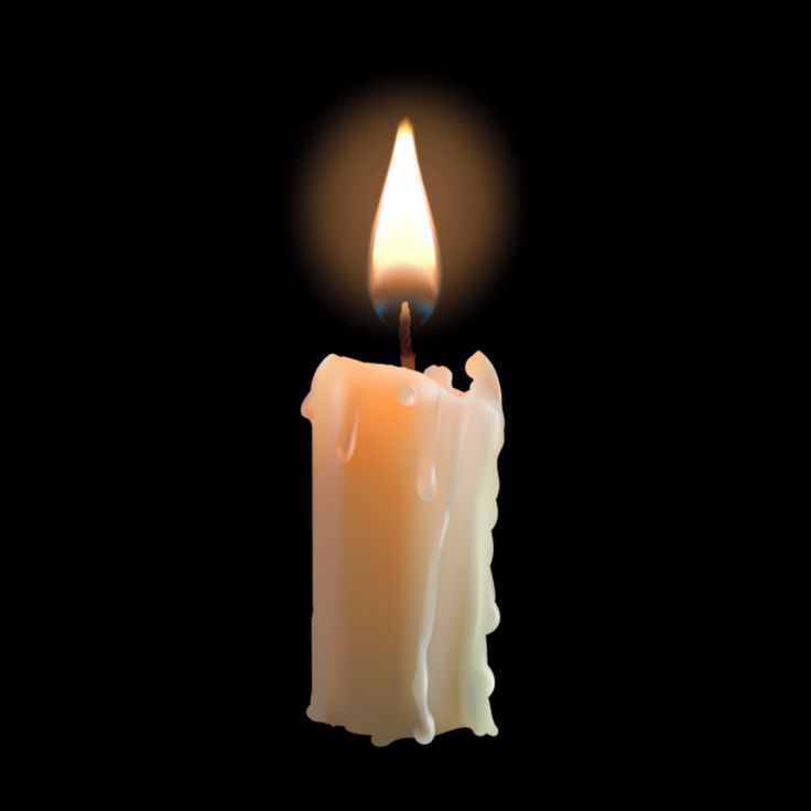 a lit candle with a black background