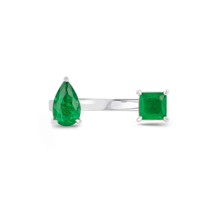 Design Based off of our best selling Stella Ring, the Reign Ring features two beautiful half-carat emeralds (pear shape and princess cut) in a floating style 14K gold setting. Wraps perfectly around your finger to create the illusion of emeralds floating between your fingers. Details & Dimensions - 1.00 carats (0.50 carats pear shape, 0.50 carats princess cut) - If in between sizes, please order the nearest half size down. Green Emerald, White Ring, Pear Shape, Princess Cut, Reign, Pear Shaped, Pear, Floating, Emerald