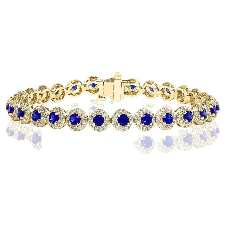 Add color to your style with this gorgeous Blue Sapphire bracelet. Features 29 Round cut blue sapphires surrounded by a single row of sparkling 377 round diamonds in a halo setting. Sapphires and diamonds weigh 4.67 carats and 1.57 carats total respectively. Made in 14-karat yellow gold. All diamonds are GH color SI1 Clarity. Available in Ruby and Emerald as well. Style is available in different price ranges. Prices are based on your selection. Don't hesitate to get in touch with us for more information. Blue Sapphire Bracelet, Bracelet Tennis, Halo Setting, Sapphire Bracelet, Tennis Bracelet Diamond, Sapphire Diamond, Tennis Bracelet, Blue Sapphire, Round Cut