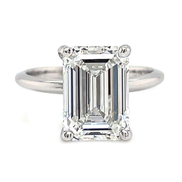 This exquisite diamond is a IGI Certified 4.15 ct. Lab Created Emerald Cut Diamond featuring colorless white F color and eye clean VS1 clarity. This magnificent diamond is set on this 14 kt. White Gold Solitaire mounting. We can make this ring in her exact finger size, just let us know and your ring will arrive ready to place on her finger. White Diamond Ring With Vs Clarity In Asscher Cut, White Asscher Cut Diamond Ring With Vs Clarity, Gia Certified Emerald Cut Diamond Ring In Diamond White, White Solitaire Baguette Cut Diamond Ring, Vvs Clarity Emerald Cut 14k White Gold Diamond Ring, White Gold Baguette Cut Diamond Ring Vs Clarity, White Emerald Cut Platinum Diamond Ring, Gia Certified Classic Lab-grown Diamond Wedding Ring, White Diamond Ring Vvs Clarity Classic Cut