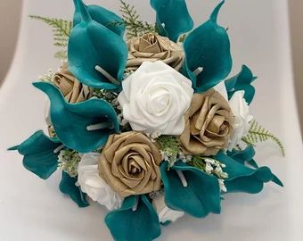 a bridal bouquet with white and blue flowers