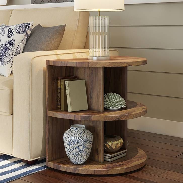 a living room with a couch, table and lamp