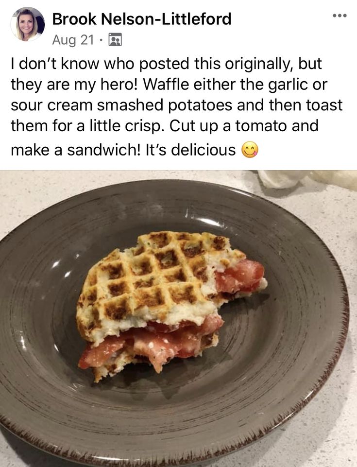 a waffle sandwich on a plate with bacon