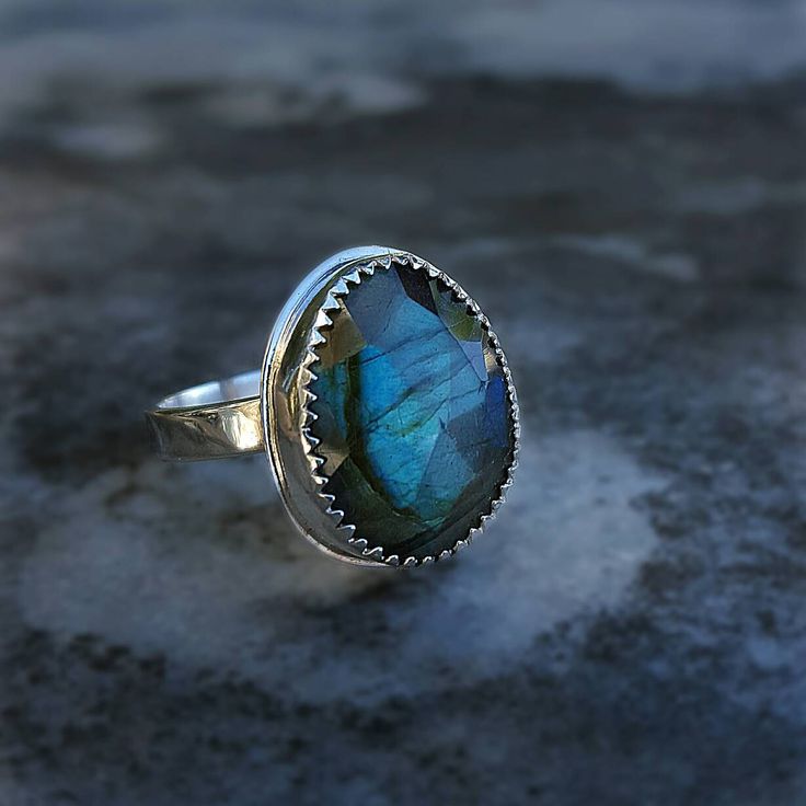 Labradorite Ring Labradorite Labradorite Jewelry Labradorite Ring Silver Gemstone Ring Statement Ring Labradorite Rings Blue Labradorite Unique statement ring featuring a blue green flash,labradorite gemstone.Elegant, delicate and versatile. Materials: ✔Sterling silver band ✔High quality labradorite gemstone. ✔Gemstone size appr.6-8mm Ideal gift for that special lady, bridesmaids, best friend, mom, sister, daughter, aunt and teacher! 📌 Important note regarding Labradorite - the colors cannot be Labradorite Gemstone Oval Ring, Oval Labradorite Gemstone Ring, Oval Labradorite Ring With Natural Stones, Handmade Healing Ring With Oval Cabochon, Large Round Labradorite Gemstones, Handmade Labradorite Oval Cabochon Ring, Handmade Labradorite Spiritual Rings, Adjustable Labradorite Cabochon Ring, Adjustable Cabochon Labradorite Ring