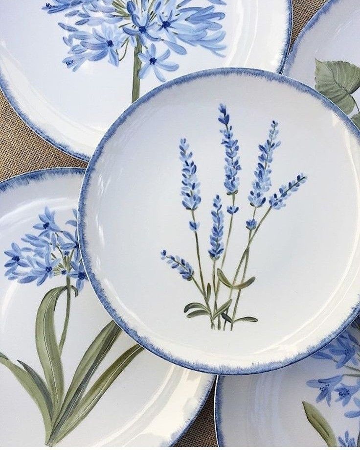 blue and white plates with flowers painted on them