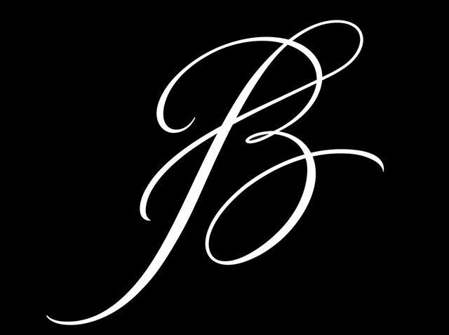 the letter b is shown in black and white with an elegant font that looks like it has