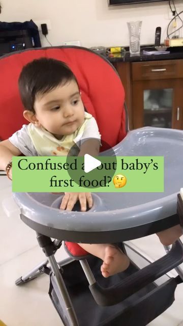 a baby sitting in a high chair with the caption confused about baby's first food?