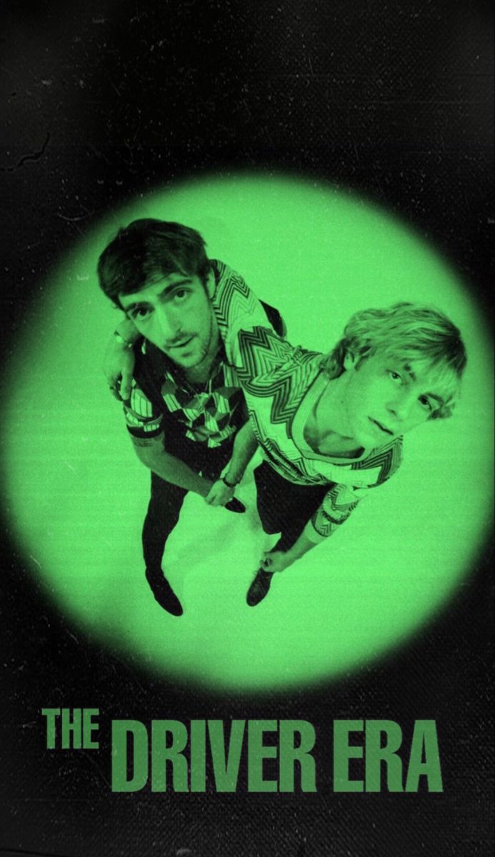 the driver era movie poster with two young men in front of a green circle and black background