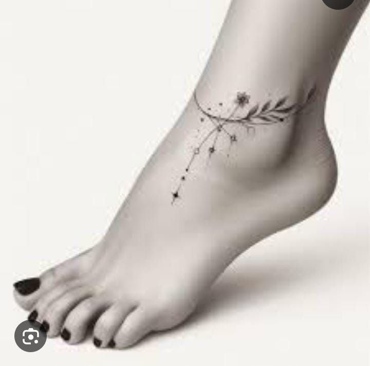 a woman's foot with a flower tattoo on it