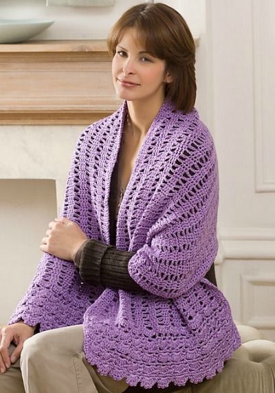 a woman wearing a purple shawl with the words crochet friendship shawl