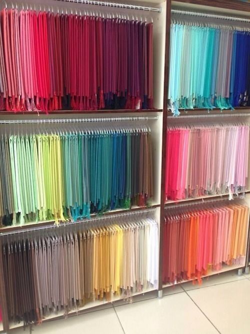 the shelves are filled with many different colored straws