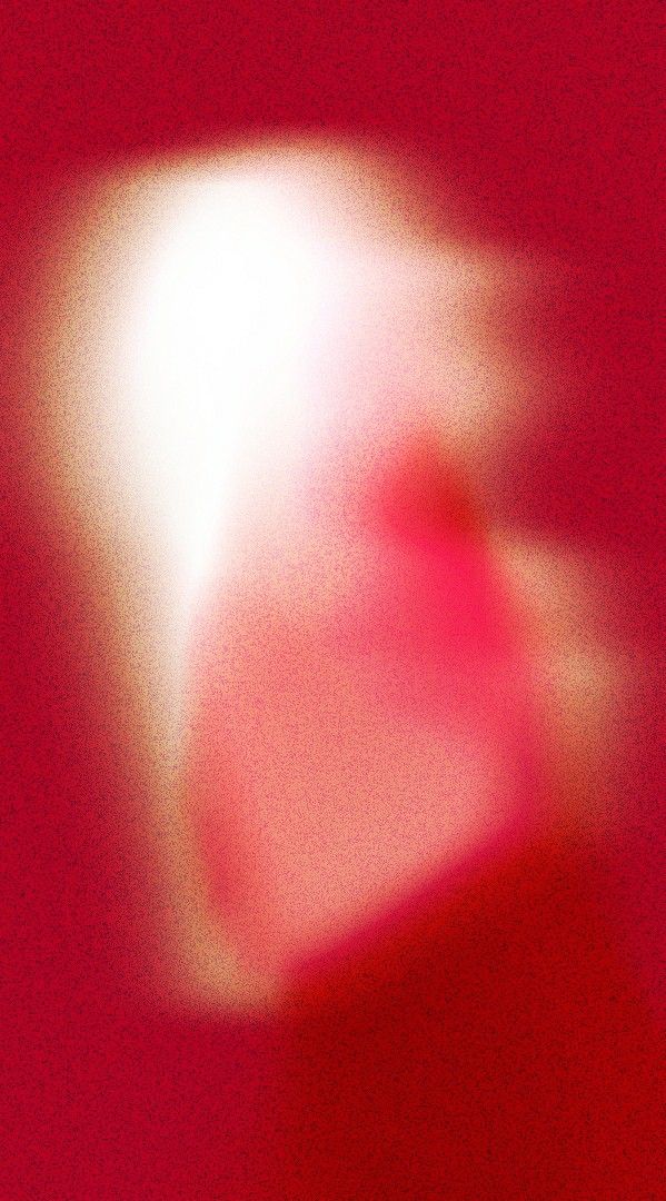 blurry image of an object in red and white