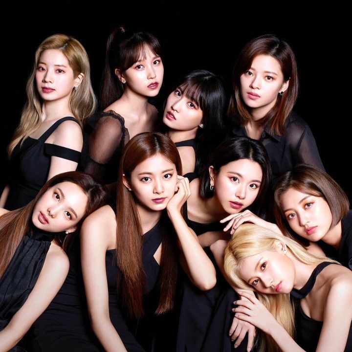 the girls are posing together in black dresses