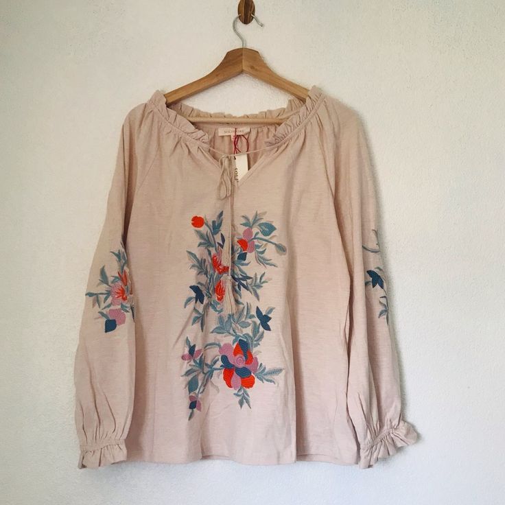 Solitaire Floral Embroidered Peasant Top Condition: New With Tag Size: Medium Color: Light Cream Approx Measurements Pit-Pit: 20.5” L: 27” Peasant Style Embroidered Top With Floral Embroidery For Fall, Peasant Style Embroidered Top With Floral Details For Fall, Folk Style Blouse With Tonal Embroidery For Spring, Beige Cotton Peasant Top For Spring, Beige Cotton Peasant Top, Embroidered Long Sleeve Beige Peasant Top, Cream Long Sleeve Peasant Top With Floral Embroidery, Spring Cream Peasant Top With Floral Embroidery, Spring Beige Peasant Top With Floral Embroidery