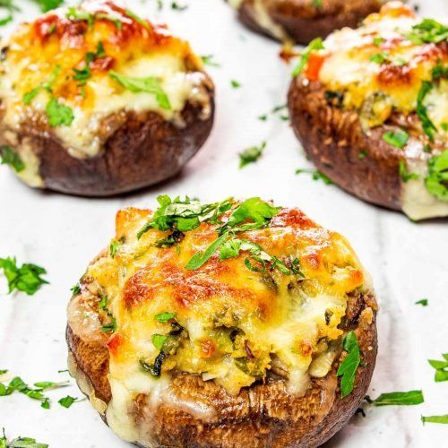 baked potatoes with cheese and herbs on top