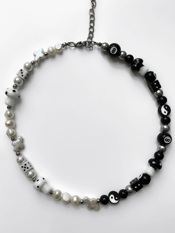 "The 'YIN & YANG' half black, half white freshwater pearl necklace is what you've been waiting for - perfect for those who are looking to dress up any outfit with jewelry! No matter how this necklace is styled, the 'YIN & YANG' will get heads turning, guaranteed. Made with lamp work charms & freshwater pearls. Waterproof and rust-free. Available in lengths 14\", 15\", 16\", 18\", 20\". Model is wearing 15\". Handmade in Los Angeles." Outfit With Jewelry, Yoga Pendant, Yin Yang Necklace, Dope Jewelry Accessories, Om Pendant, Yoga Necklace, Diy Jewelry Necklace, Beaded Necklace Designs, Indie Jewelry