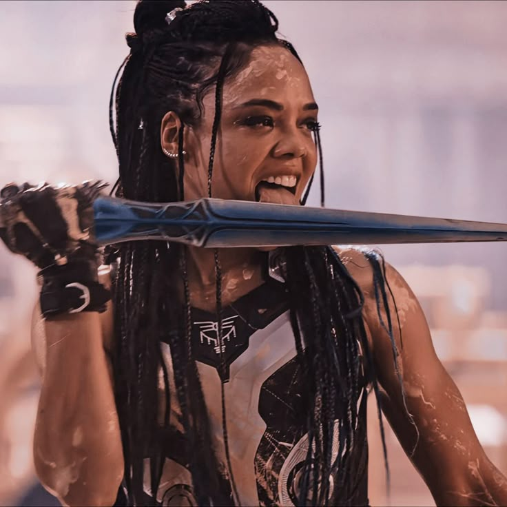 a woman with dreadlocks holding a baseball bat