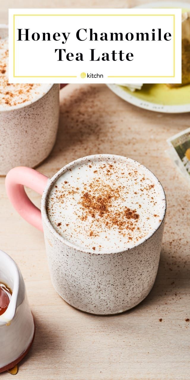 two mugs filled with honey chamole tea latte sitting on a table