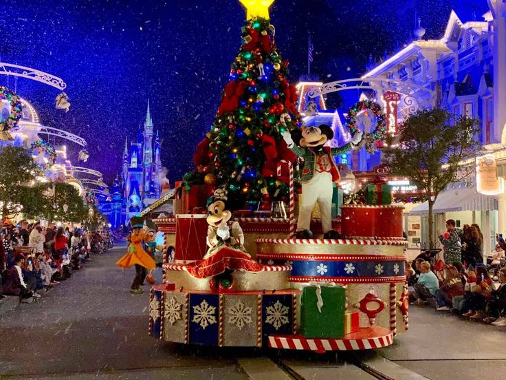 a parade float decorated with christmas lights and decorations