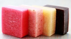 four different colored soap bars sitting next to each other