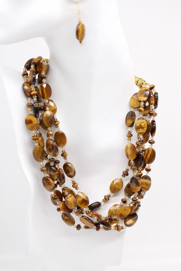 Tiger's Design will give an exotic look to any outfit, from warm summer nights to elegant holiday gatherings you will shine. Five strands of Luscious faceted Tiger's Eye ovals and rondelles with gold spacers and Swarovski© Crystal. The chain is adjustable to make it a perfect fit for any outfit while its gorgeous accents will keep you turning heads both socially and professionally. Tiger Eye Jewelry, Tiger Design, Jewelry Accessories Ideas, Murano Glass Beads, Accessories Ideas, Tiger's Eye, Eye Jewelry, Holiday Gathering, Summer Nights