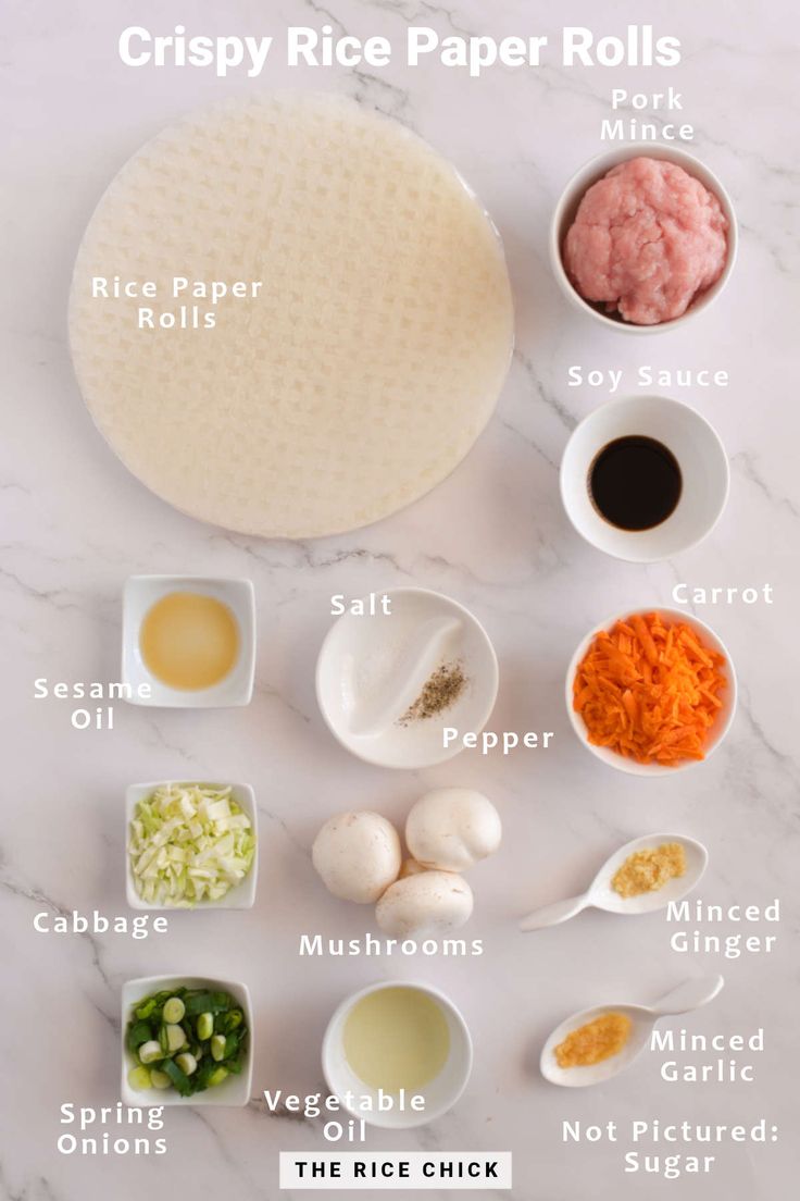 ingredients for crispy rice paper rolls laid out on a white marble counter top with text overlay