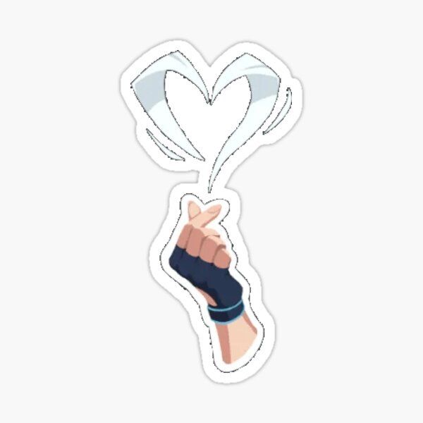 a hand holding up a heart sticker