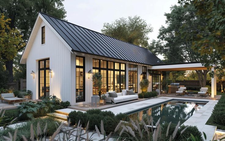 a house with a pool in the middle and lots of plants around it, surrounded by trees