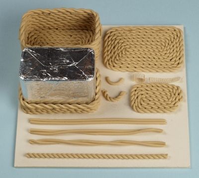 a bunch of items that are sitting on a table together in the shape of baskets