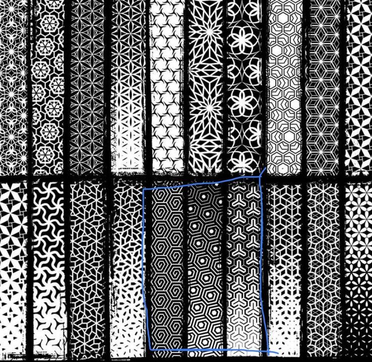 an array of black and white patterns with blue lines in the center, on a dark background