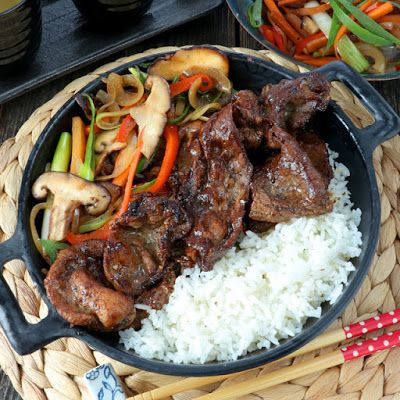 the meal is prepared and ready to be eaten on the table with chopsticks