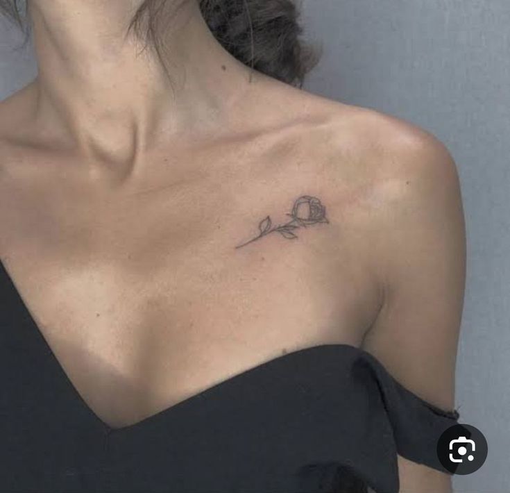 a woman with a small tattoo on her chest