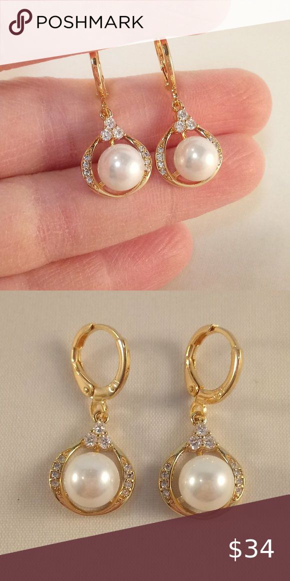 18K Gold Filled Pearl Topaz Zircon Hoop Earrings These beautiful pearl flower earrings are 18K yellow gold filled with small (lab-created) white topaz zircon gemstones. Brand new, never been worn. These fine quality earrings are perfect for any occasion or a special gift. Get an $18 gift of your choice in my listings with purchase of two or more items. Please send offers and questions.   Earrings: 28x15mm or 1.10" x .59" Hoop Diameter: 15mm or .59" Imitation Pearl: 7mm or .28" diameter Fastening Gold Pearl Earrings With Cubic Zirconia, Gold Cubic Zirconia Round Pearl Earrings, Gold Drop Pearl Earrings With Diamond Accents, Gold Pearl Earrings With Diamond Accents And Cubic Zirconia, Gold Pearl Earrings With Diamond Accents, Gold Pearl Earrings With Cubic Zirconia In Prong Setting, Gold Huggie Pearl Earrings For Anniversary, Dainty Gold Pearl Earrings With Cubic Zirconia, Elegant Yellow Hoop Earrings As Gift