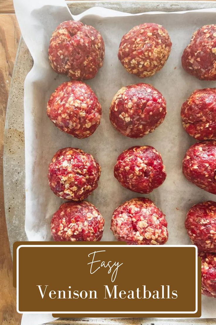 some meatballs are in a white tray on a table with the words easy venison meatballs