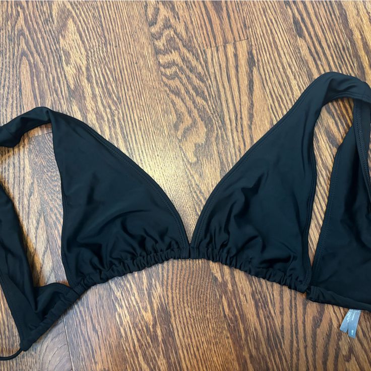 Never Worn, Perfect Condition Fits True To Size No Padding Black Triangle Top Swimwear For Vacation, Black Halter Neck Top For Vacation, Black T-back Swimwear With Built-in Bra, Black T-back Halter Top For Poolside, Black Backless Halter Top With Built-in Bra, Beachwear Triangle Halter Top For Night Out, Black Summer Party Swimwear, Black Seamless Halter Neck Swimwear, Summer Black T-back Swimwear