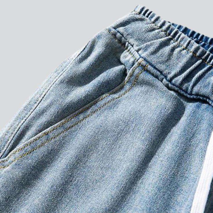 Revive the 90s vibe with our 2023 Spring-Summer Collection of baggy men's denim joggers! These mid-waist. drawstrings closure joggers will take you back to the iconic fashion of the millennium with their light wash. giving you the perfect balance of modern and vintage fashion.Why You'll Love It 90s Vibe: Unapologetically playful and stylish. the 90s vibe radiates from this denim jogger. Light Wash: The light wash ensures a soft and subtle look. allowing you to make a statement without being too Hip Hop Style Medium Wash Pants For Spring, Spring Hip Hop Style Medium Wash Pants, Trendy Summer Jeans With Drawstring, Casual Cotton Cargo Jeans For Summer, Hip Hop Style Medium Wash Bottoms For Spring, Casual Summer Cotton Cargo Jeans, Summer Cotton Jeans With Drawstring, Medium Wash Hip Hop Bottoms For Spring, Casual Summer Jeans With Elastic Waistband