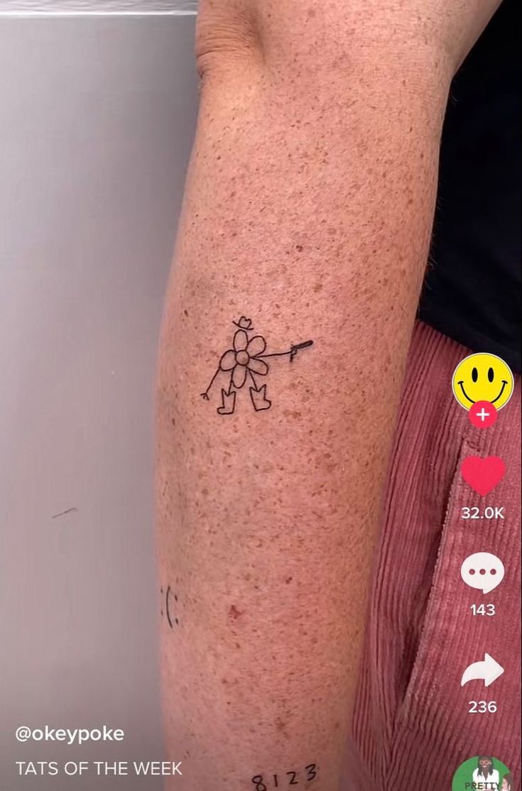 a person with a tattoo on their arm