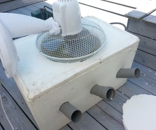 an air conditioner sitting on top of a wooden deck