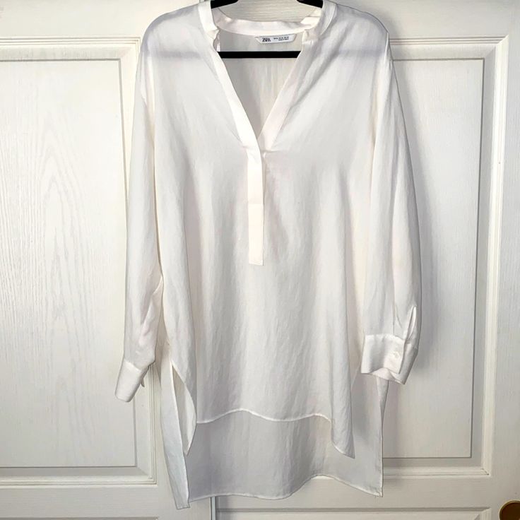 Cute Mandarin Collar Tunic Top. V-Neck And One Button. Length In The Front Is 32 1/2” Length In The Back Is 35”.,P-P 46”, Sleeves 22 1/4” Long. Polyester/Llyocell, Machine Washable. Nwot White V-neck Blouse For Layering, Chic V-neck Tunic For Spring, Casual V-neck Tunic For Brunch, Summer Tunic Blouse For Workwear, Chic Spring Button-up Tunic, Chic Button-up Tunic For Spring, Chic V-neck Blouse For Layering, Casual V-neck Tunic For Daywear, Chic V-neck Spring Tunic